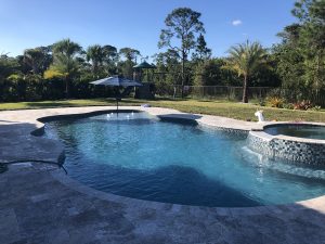 Aruba Swimming Pool Resurfaced and Pavers Installed by Aquatic Surfaces